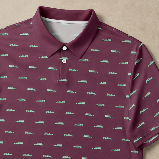 Maroon polo shirt with green truck pattern on a beige background