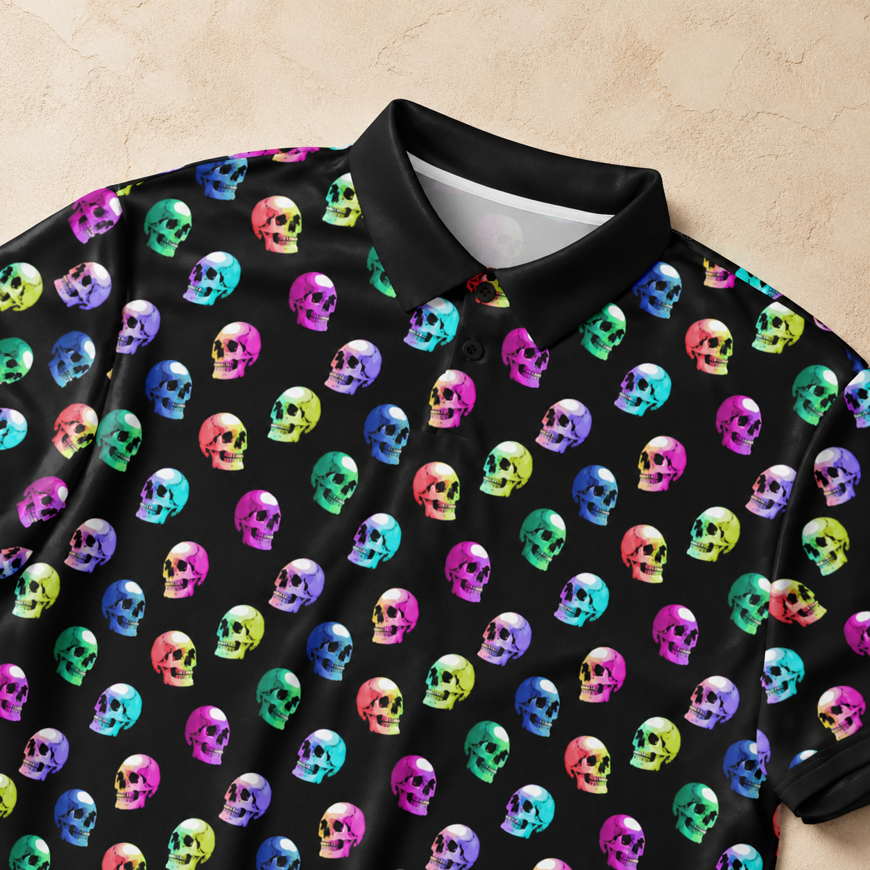 Black shirt with colorful skull pattern on a beige background