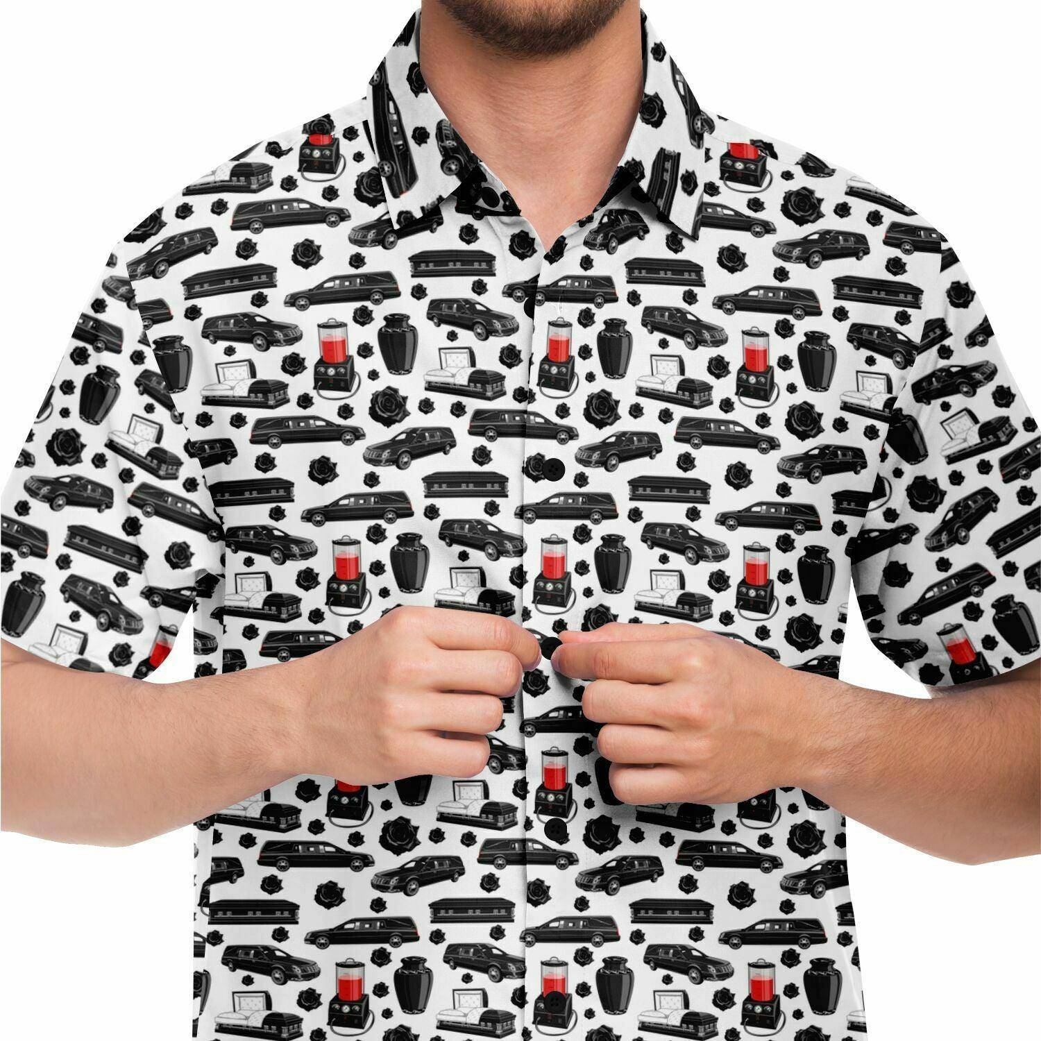 close up front view of white button up shirt with funeral pattern containing black hearse, coffin, casket, cremation urn, embalming machine, roses