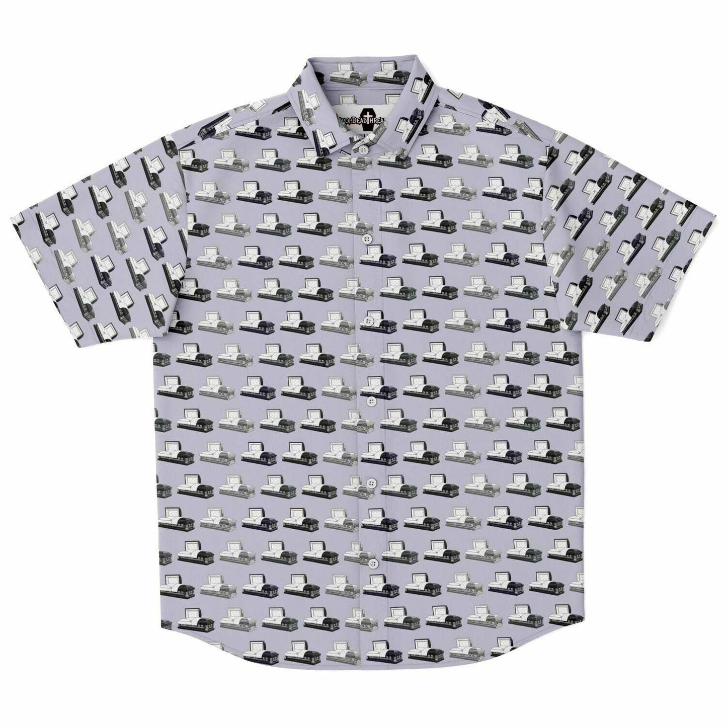 Light purple button up short sleeve tee shirt with dark grey, silver, and dark purple open caskets or coffins. Front view