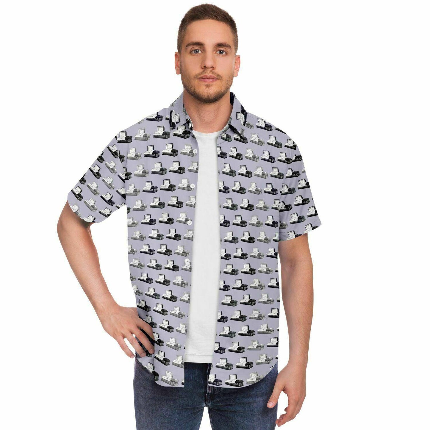 Male model with opened button down tee in light purple. Pattern has dark grey, silver, and purple coffins and caskets