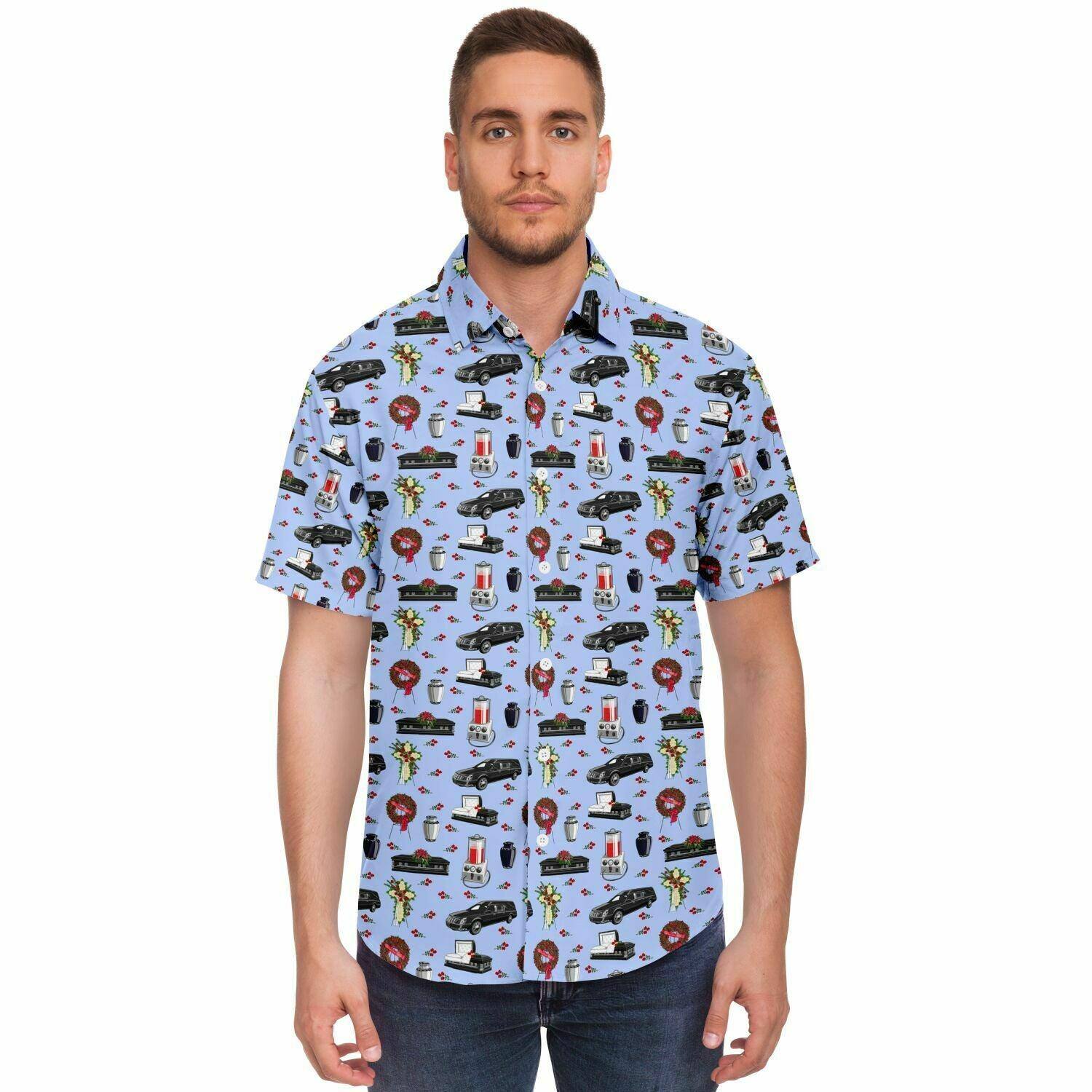 Front view man wearing light blue button down tee shirt with black hearse, casket, coffin, embalming machine, white cremation urn, pattern