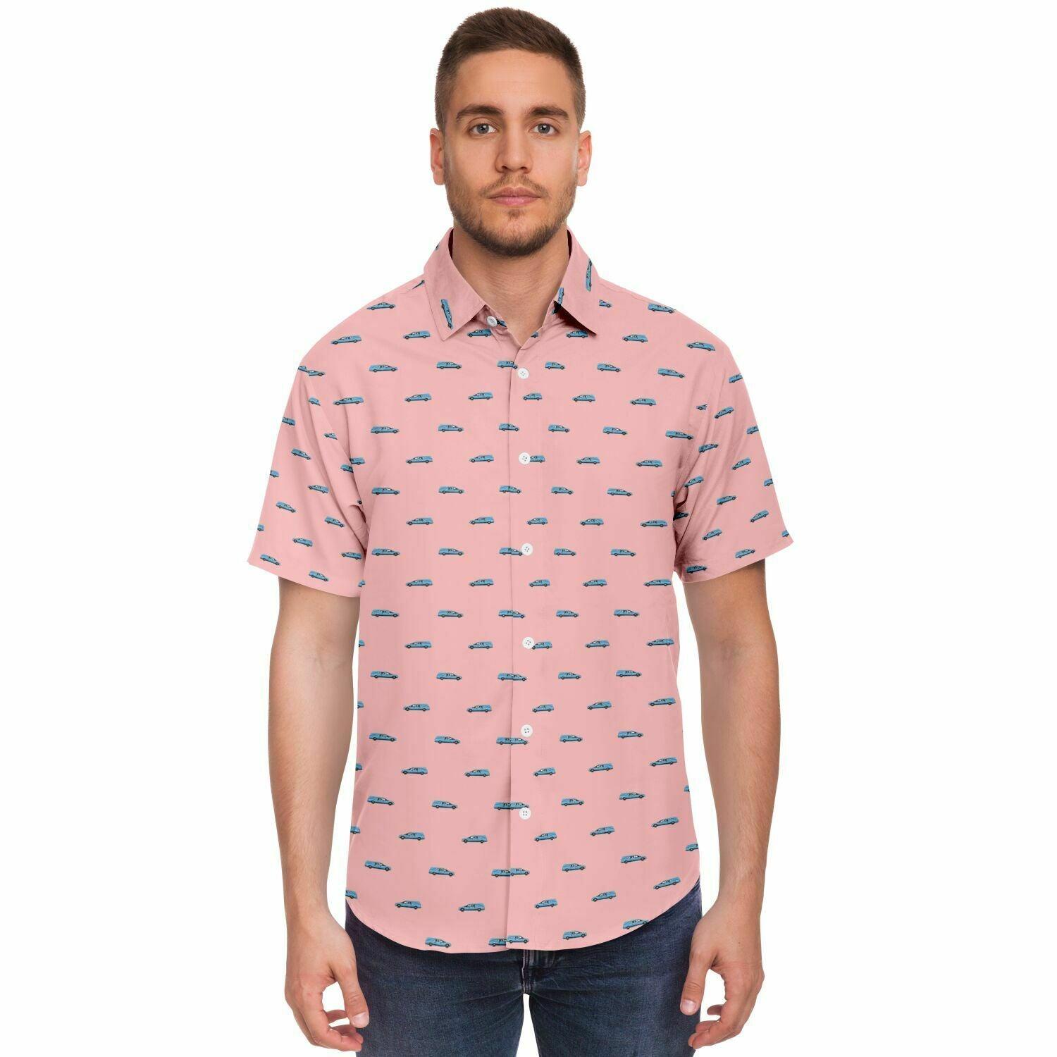 man wearing a light pink button down tshirt with light blue funeral coach hearse pattern. Frontal view.