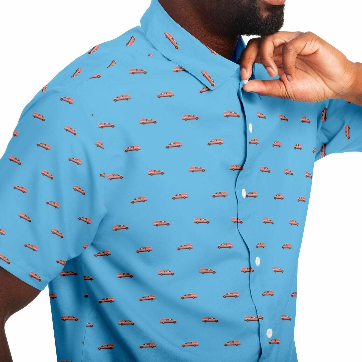 baby blue button up tshirt with a pink hearse funeral coach pattern. Close up side view