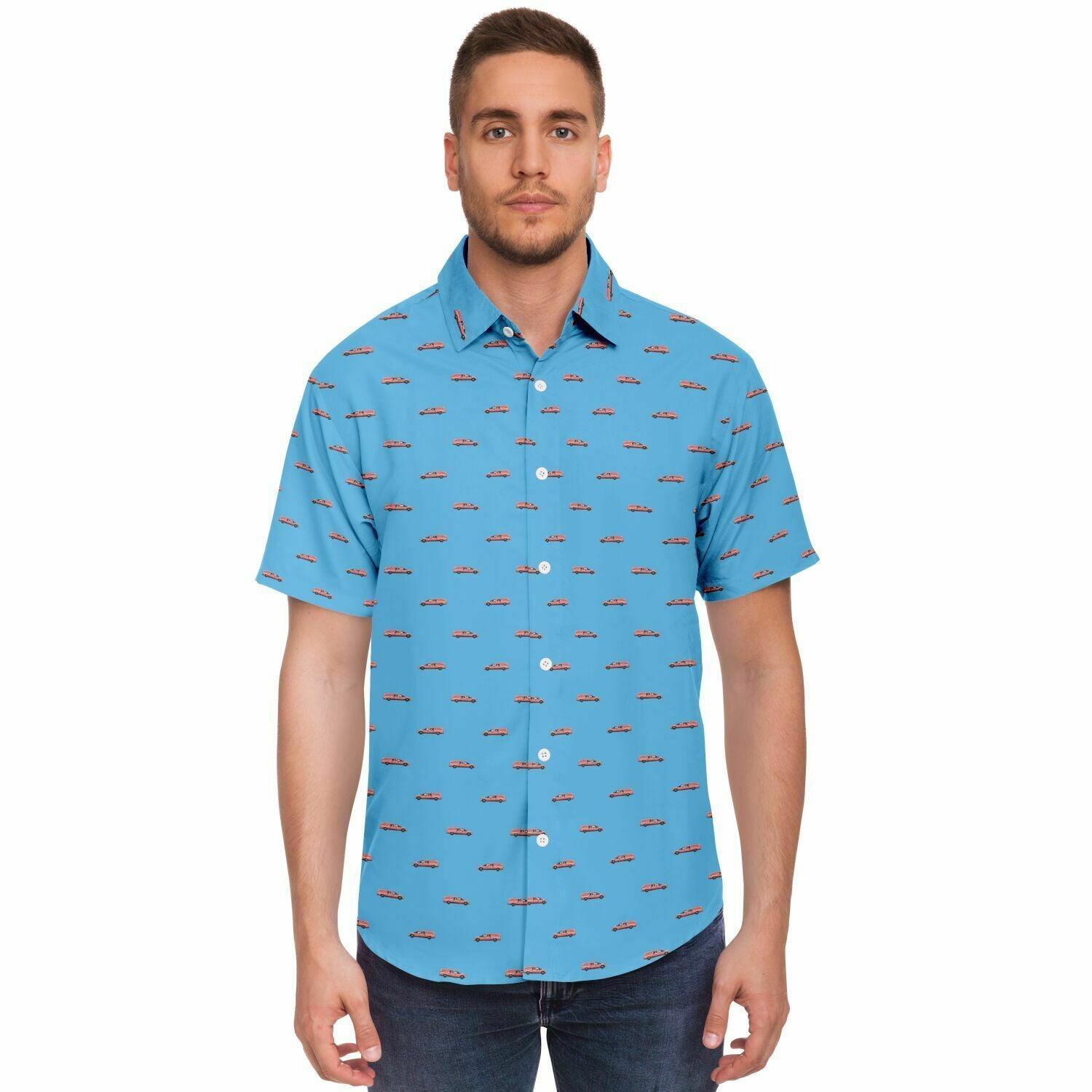 man wearing a baby blue button down short sleeve shirt with a pattern containing a pink hearse. Front view