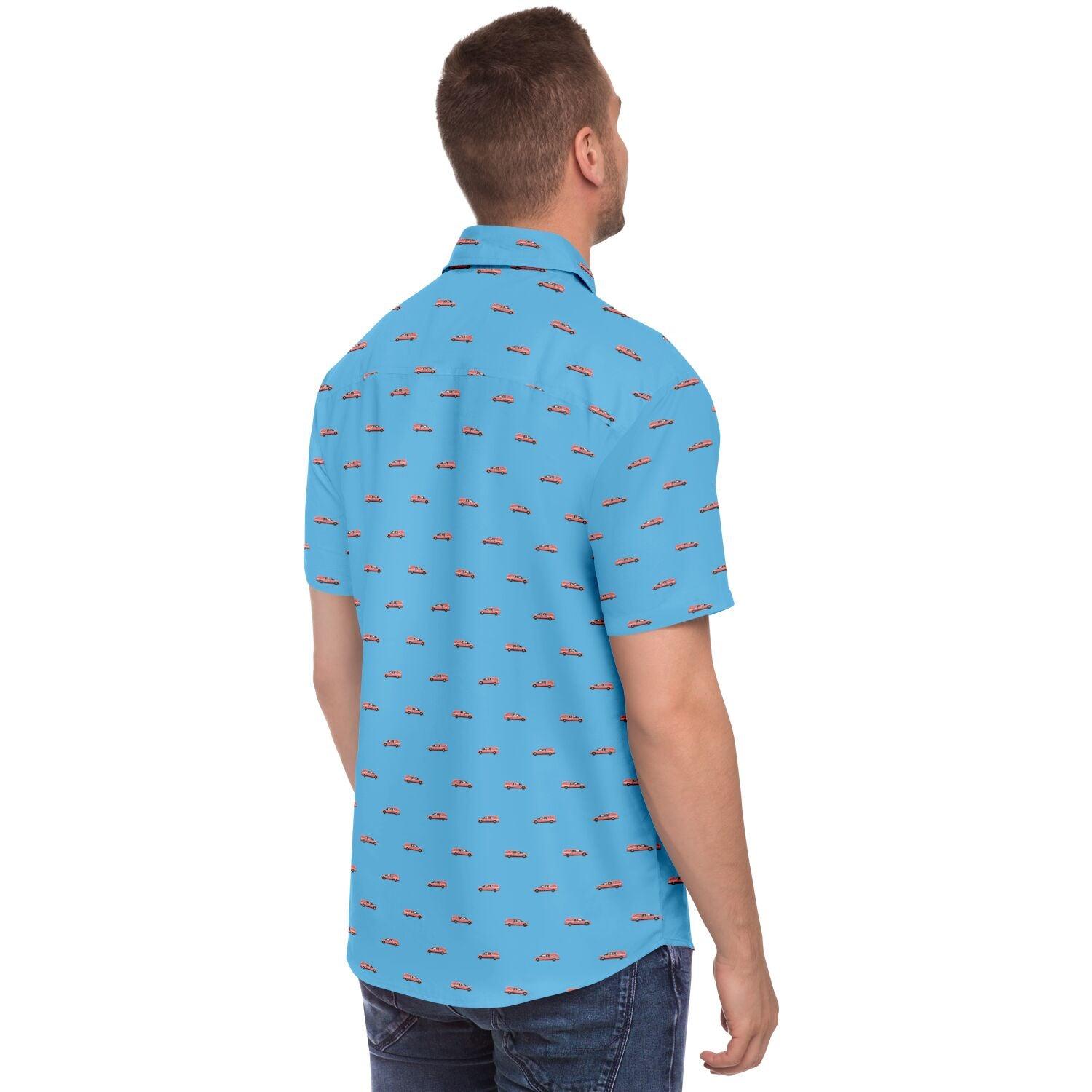 Model wearing a baby blue button up shirt with short sleeves and a pink hearse pattern. Back side angle view