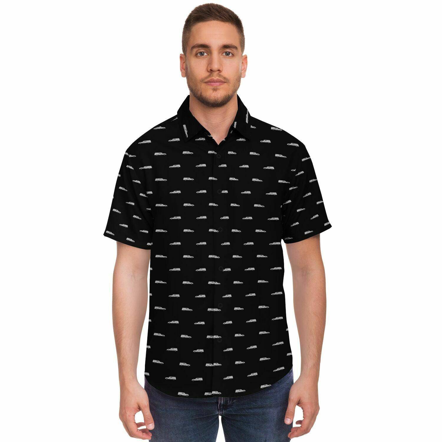 Male Model wearing a black button up short sleeve shirt with silver hearses funeral coach hearse pattern. Frontal view