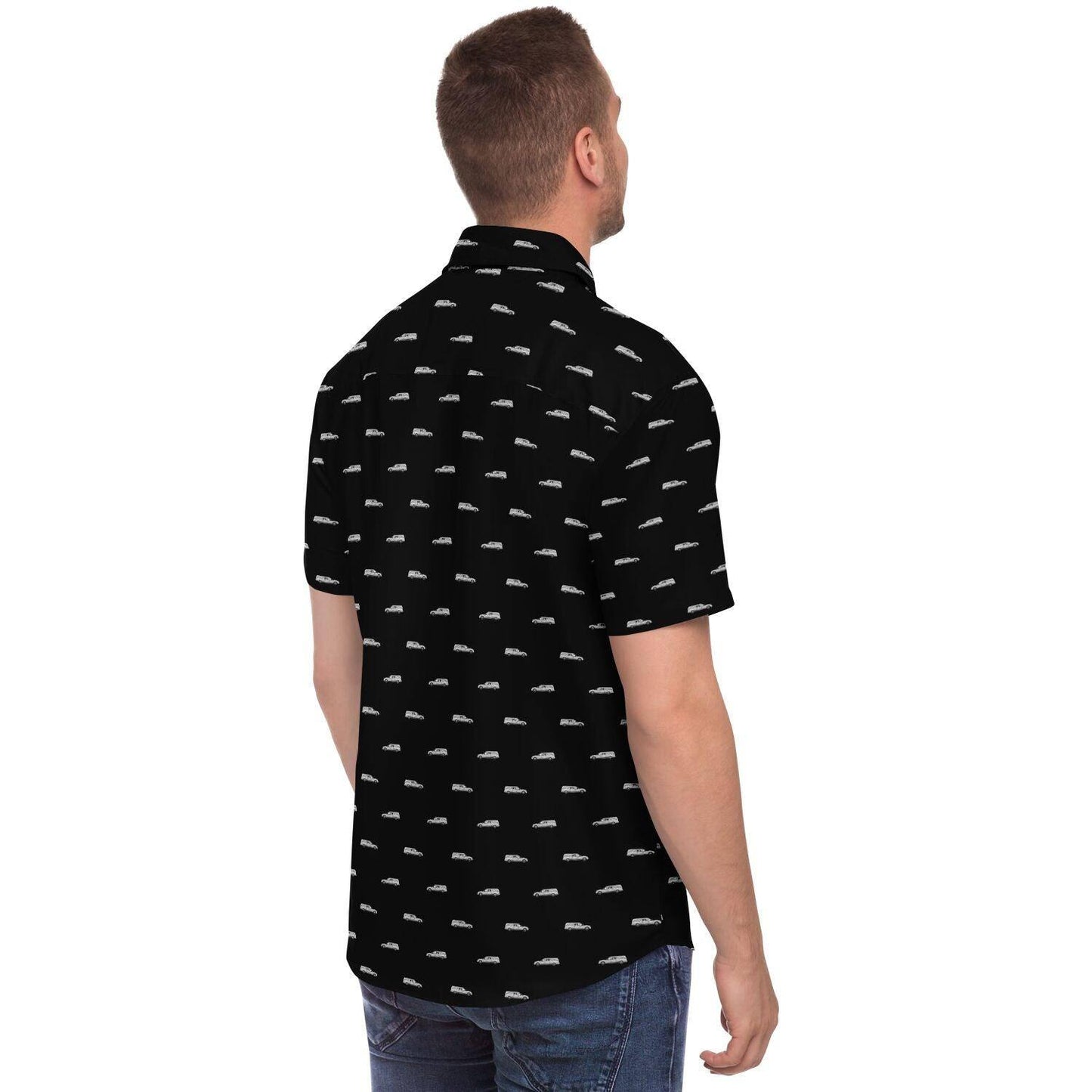 Model wearing black button up tshirt with a silver hearse funeral pattern. Back side angle view