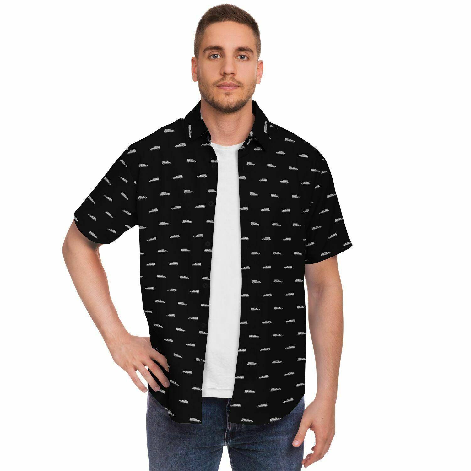 man wearing a black button up opened tee shirt with silver hearse pattern. Frontal view